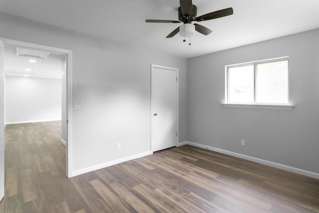 1204 N Long Hollow Rd, Chickamauga, GA 30707 - unfurnished bedroom with attic access, wood finished floors, baseboards, and ceiling fan