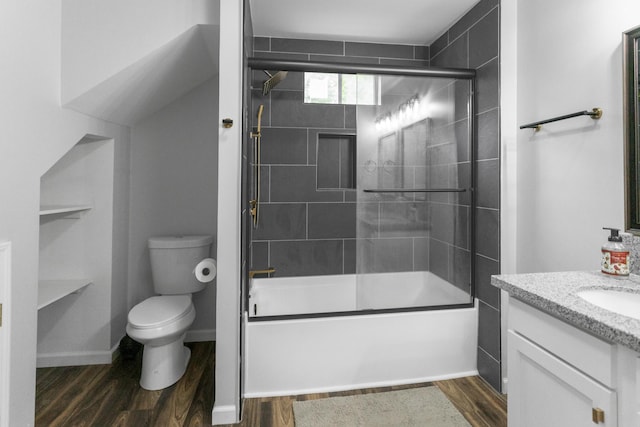 1204 N Long Hollow Rd, Chickamauga, GA 30707 - bathroom featuring toilet, vanity, enclosed tub / shower combo, and wood finished floors