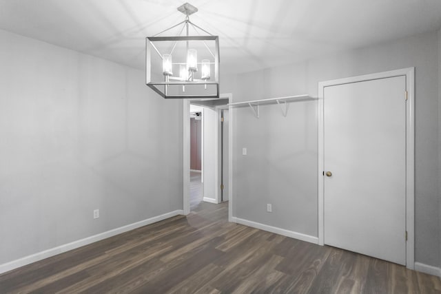 1204 N Long Hollow Rd, Chickamauga, GA 30707 - unfurnished bedroom featuring wood finished floors, a chandelier, and baseboards