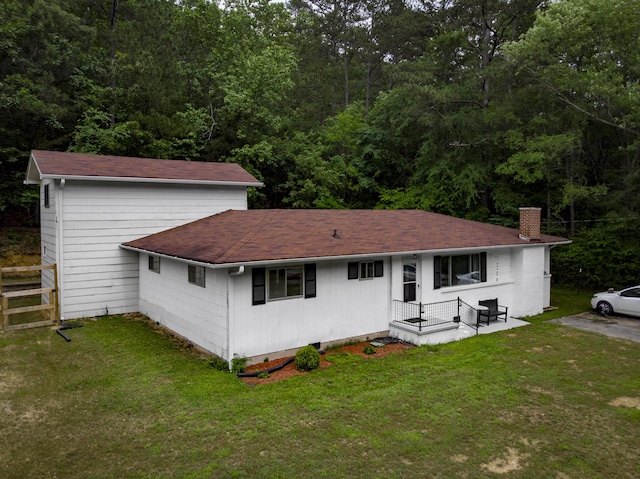 1204 N Long Hollow Rd, Chickamauga, GA 30707 - view of front facade featuring a chimney, a shingled roof, and a view of trees