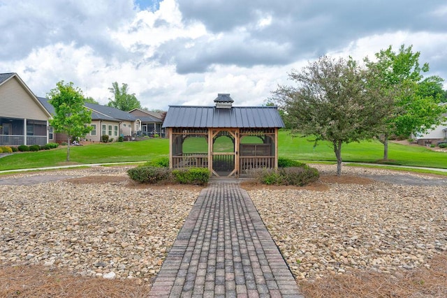 view of community featuring a lawn and a gazebo