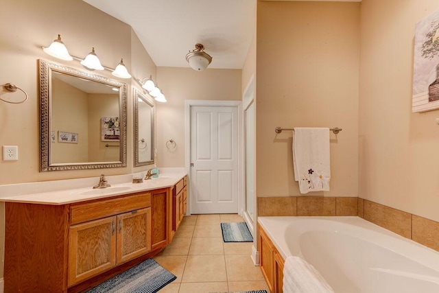 full bath featuring a sink, tile patterned flooring, a garden tub, and double vanity