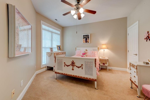 bedroom featuring baseboards, ceiling fan, light carpet, and visible vents