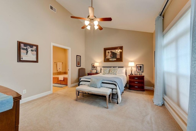 bedroom with a ceiling fan, visible vents, baseboards, connected bathroom, and light carpet