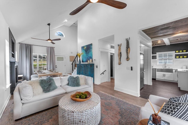 332 Oliver St, Chattanooga, TN 37405 - living area with ceiling fan, baseboards, stairway, dark wood-style flooring, and high vaulted ceiling