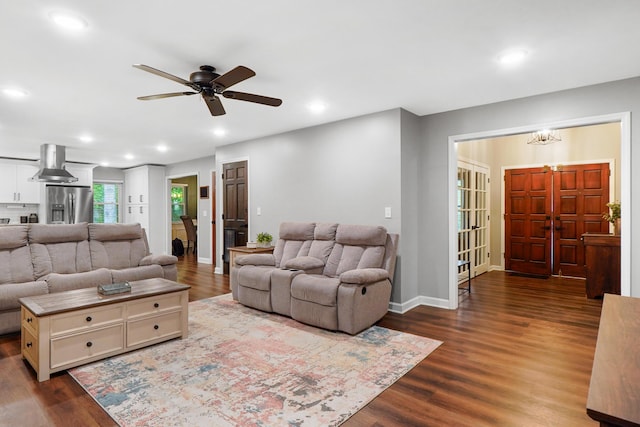 living area featuring dark wood-style flooring, a ceiling fan, and recessed lighting