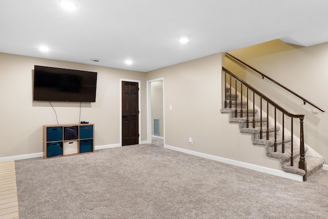 unfurnished living room with carpet, stairway, baseboards, and recessed lighting