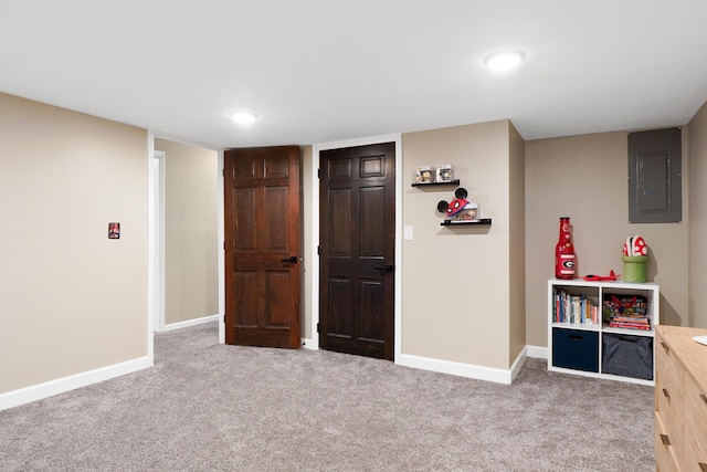 recreation room with electric panel, carpet flooring, baseboards, and recessed lighting