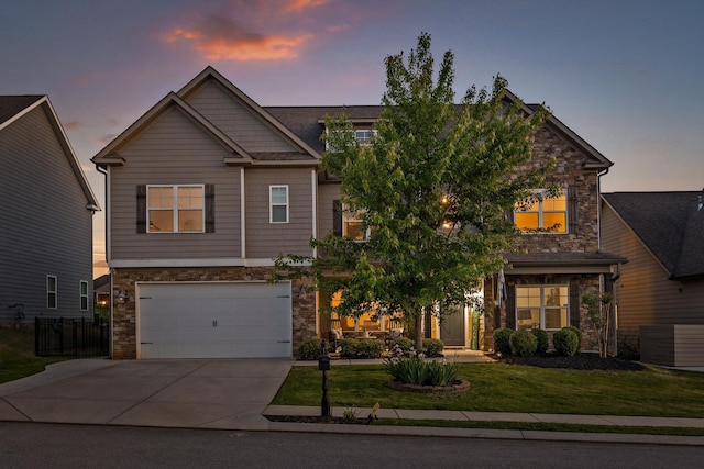 9726 Haven Port Ln, Ooltewah, TN 37363 - craftsman-style home with a yard, stone siding, an attached garage, and driveway