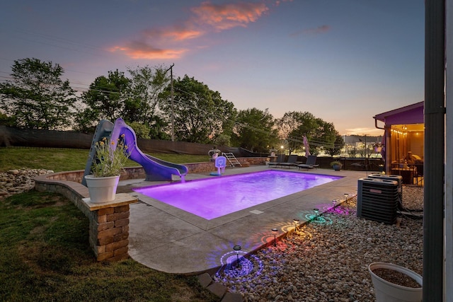 9726 Haven Port Ln, Ooltewah, TN 37363 - pool at dusk with a fenced in pool, central air condition unit, a patio area, a water slide, and a fenced backyard