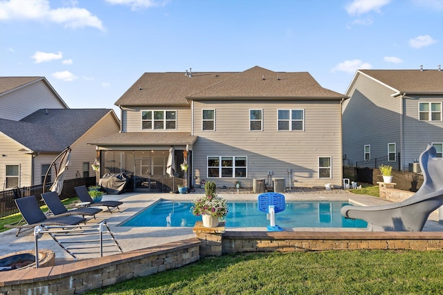 9726 Haven Port Ln, Ooltewah, TN 37363 - back of property with a fenced backyard, a sunroom, a fenced in pool, and a patio area