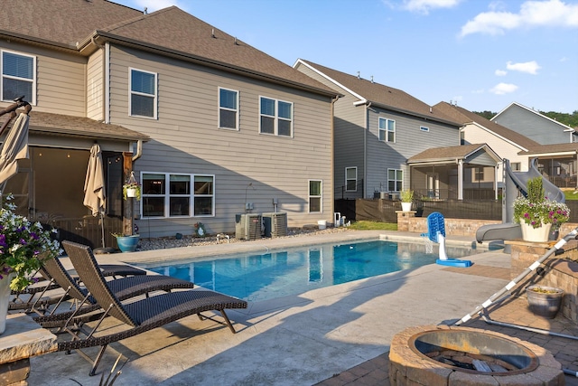 9726 Haven Port Ln, Ooltewah, TN 37363 - outdoor pool with a residential view, a fire pit, a water slide, fence, and a patio area