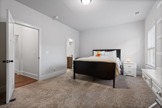 9726 Haven Port Ln, Ooltewah, TN 37363 - carpeted bedroom featuring baseboards, connected bathroom, and visible vents