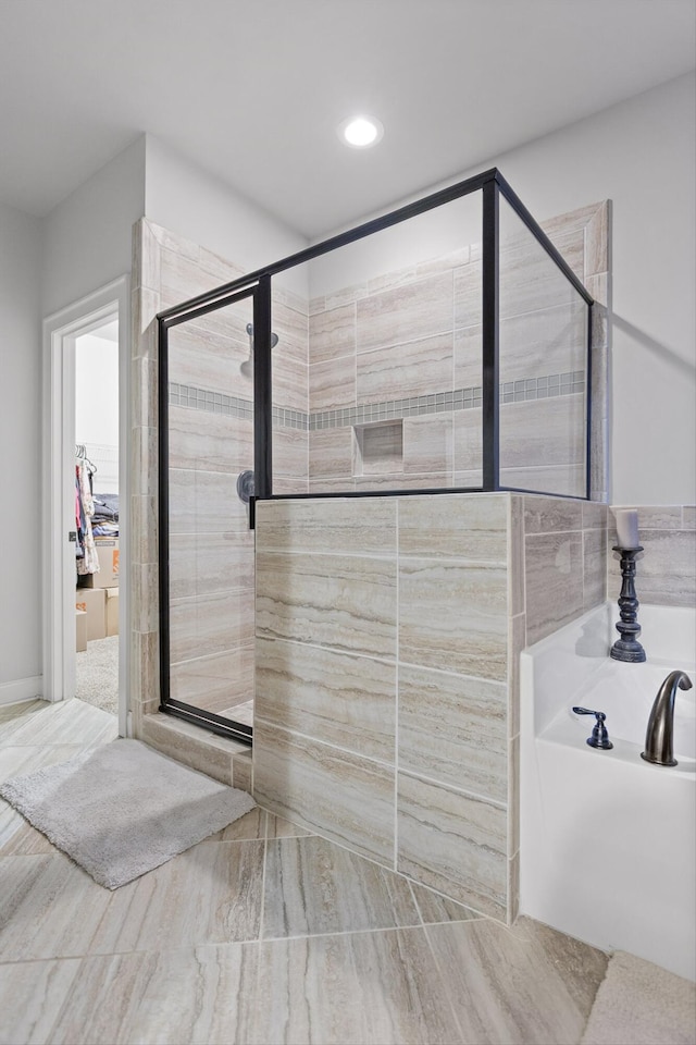 9726 Haven Port Ln, Ooltewah, TN 37363 - full bathroom with a shower stall, a garden tub, and recessed lighting