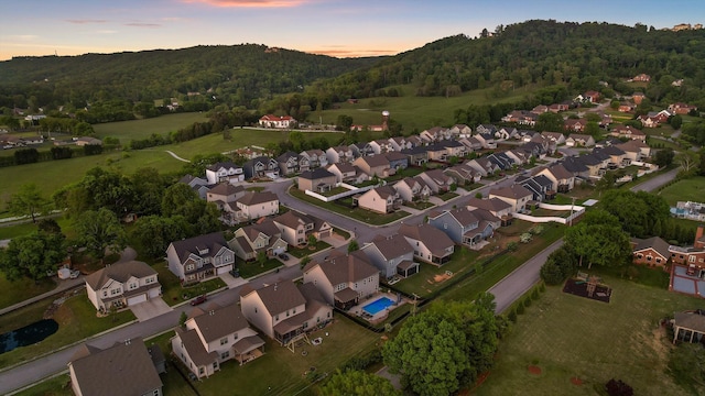 9726 Haven Port Ln, Ooltewah, TN 37363 - aerial view at dusk of a residential view and a view of trees