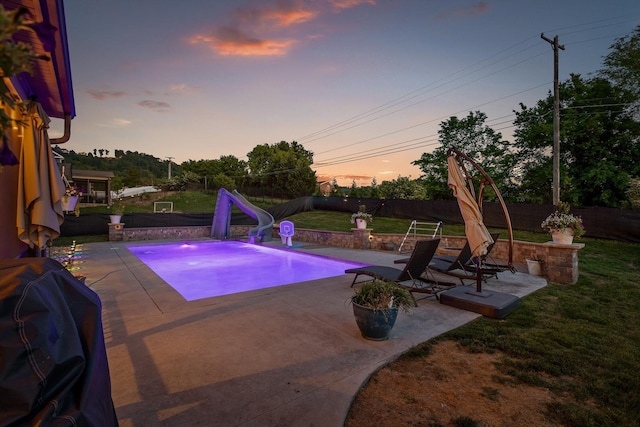 9726 Haven Port Ln, Ooltewah, TN 37363 - pool at dusk featuring a fenced backyard, a patio, and a water slide