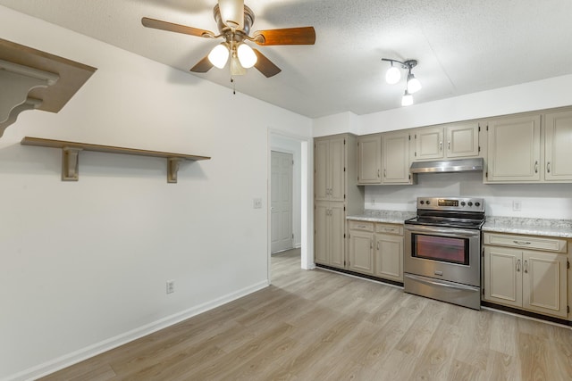 kitchen featuring under cabinet range hood, stainless steel electric range, ceiling fan, and light wood finished floors