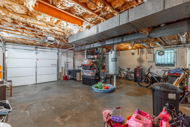 garage featuring a garage door opener and electric panel