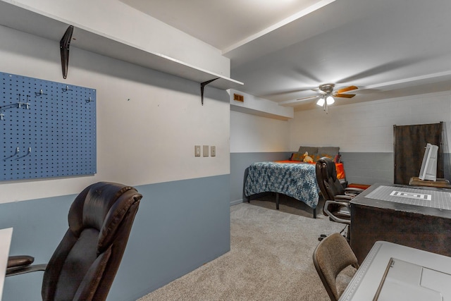 carpeted bedroom featuring visible vents, baseboards, and ceiling fan
