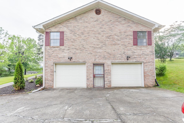 exterior space with concrete driveway