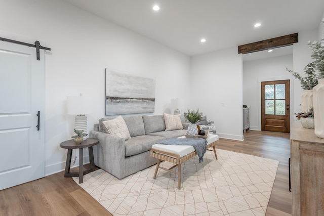 2111 Ivy St, Chattanooga, TN 37404 - living room featuring recessed lighting, baseboards, a barn door, and light wood-type flooring