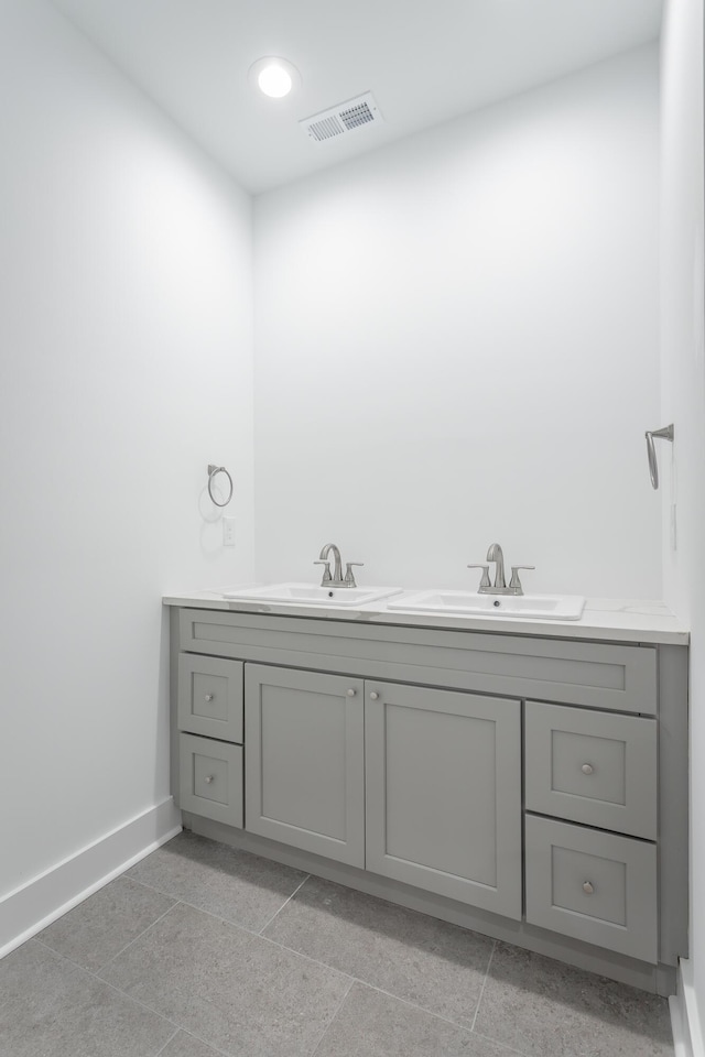2111 Ivy St, Chattanooga, TN 37404 - bathroom with visible vents, a sink, baseboards, and double vanity