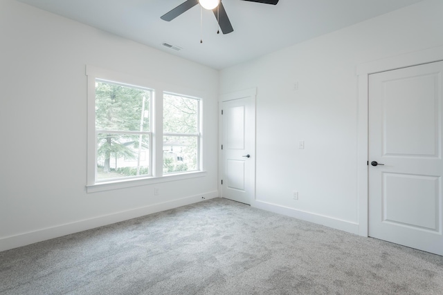 2111 Ivy St, Chattanooga, TN 37404 - unfurnished bedroom with baseboards, visible vents, ceiling fan, and carpet
