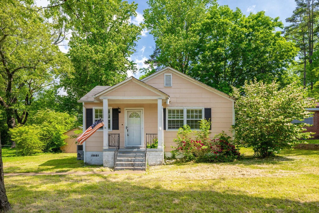 bungalow with a front lawn