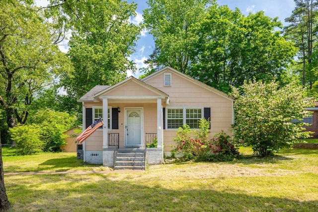 bungalow with a front lawn