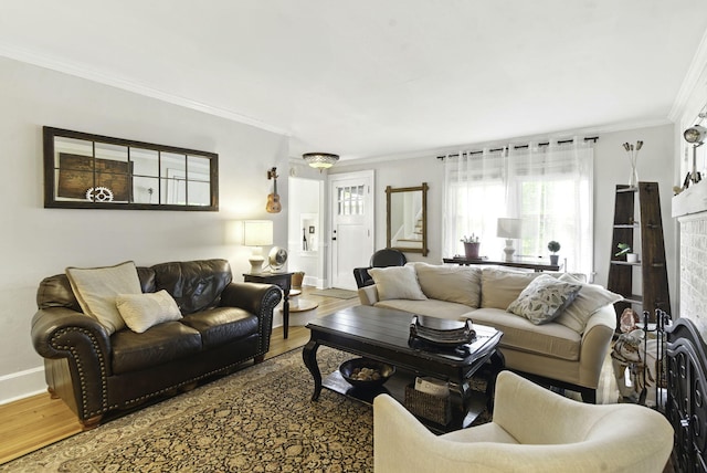 living area with baseboards, ornamental molding, stairs, and wood finished floors