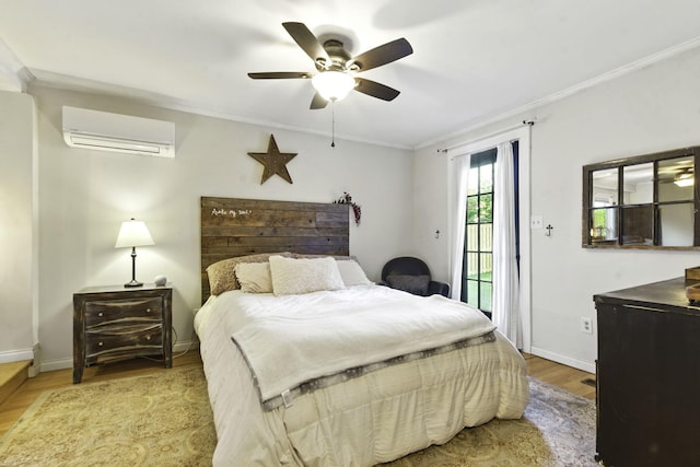 bedroom with crown molding, access to outside, baseboards, wood finished floors, and a wall mounted AC