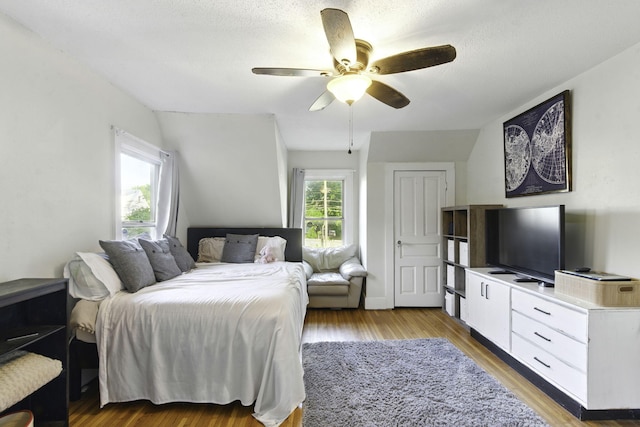 bedroom featuring a ceiling fan and light wood finished floors