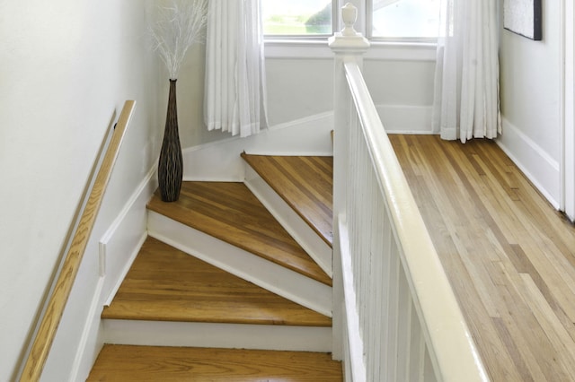 stairs with wood finished floors