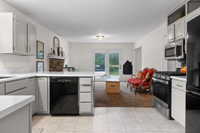 7403 Flagstone Dr, Ooltewah, TN 37363 - kitchen featuring light countertops, gray cabinets, a peninsula, and black appliances