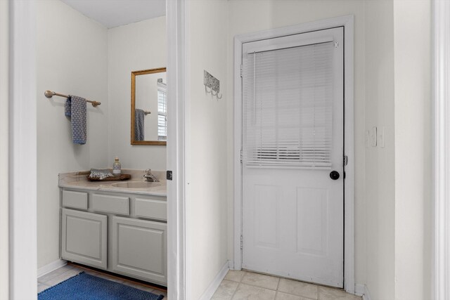 7403 Flagstone Dr, Ooltewah, TN 37363 - doorway to outside featuring baseboards, a sink, and light tile patterned flooring