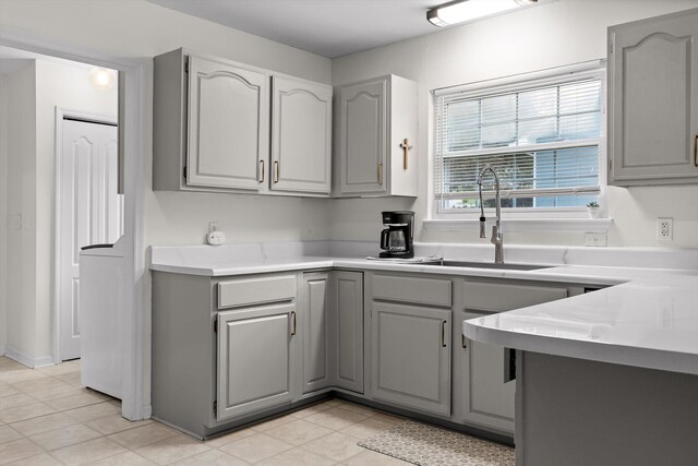 7403 Flagstone Dr, Ooltewah, TN 37363 - kitchen with light countertops, gray cabinetry, and a sink