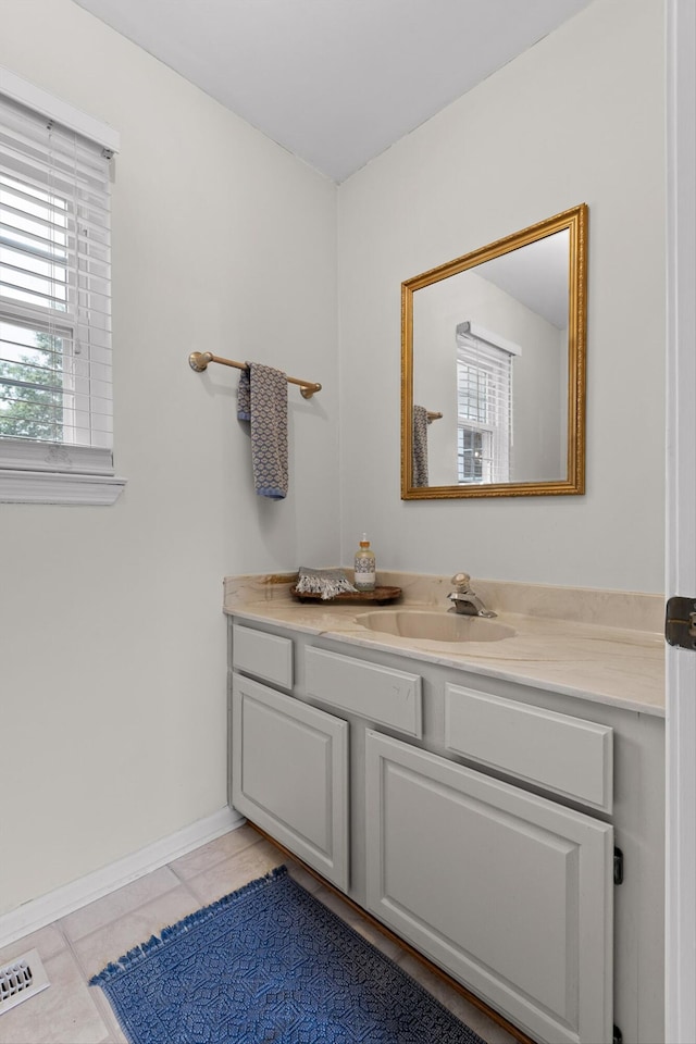 7403 Flagstone Dr, Ooltewah, TN 37363 - bathroom with vanity, baseboards, tile patterned floors, and visible vents