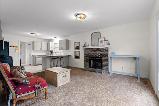 7403 Flagstone Dr, Ooltewah, TN 37363 - living area with baseboards, visible vents, light carpet, and a fireplace