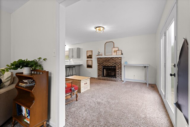 7403 Flagstone Dr, Ooltewah, TN 37363 - living area featuring carpet flooring, baseboards, and a fireplace