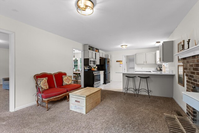 7403 Flagstone Dr, Ooltewah, TN 37363 - living room featuring a brick fireplace and light colored carpet