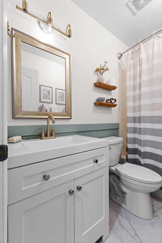 7403 Flagstone Dr, Ooltewah, TN 37363 - full bathroom featuring vanity, toilet, marble finish floor, a shower with curtain, and visible vents