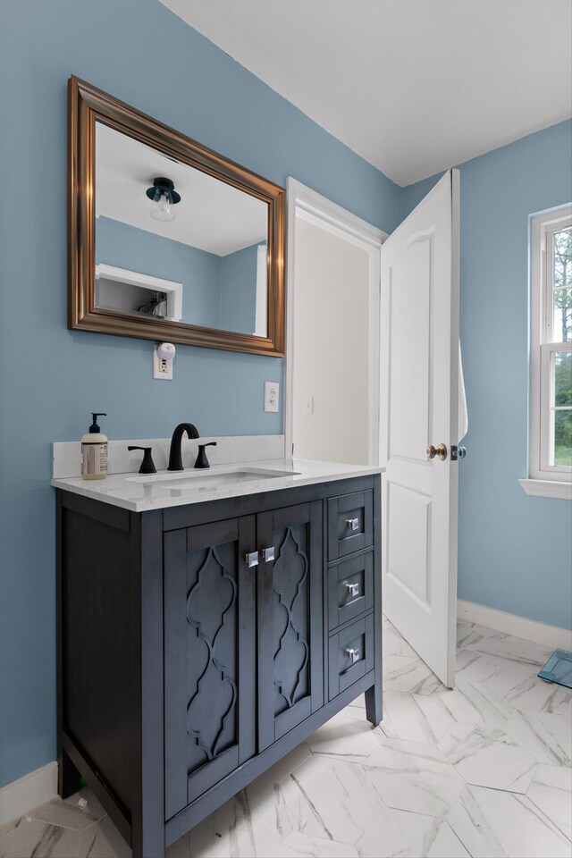 7403 Flagstone Dr, Ooltewah, TN 37363 - bathroom featuring baseboards, marble finish floor, and vanity