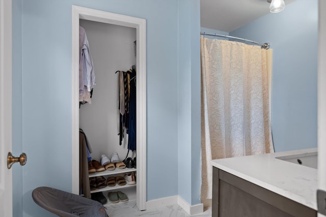 7403 Flagstone Dr, Ooltewah, TN 37363 - full bathroom with a walk in closet, a shower with shower curtain, and marble finish floor