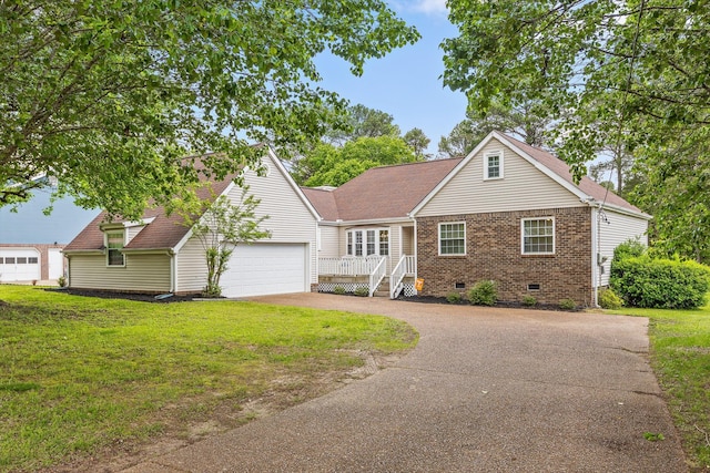 7403 Flagstone Dr, Ooltewah, TN 37363 - view of front of home featuring a garage, a front lawn, brick siding, crawl space, and driveway