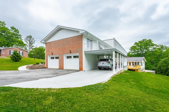 view of home's exterior with a lawn, brick siding, a carport, and aphalt driveway