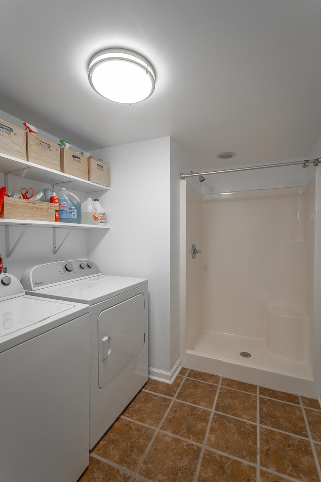 washroom with washing machine and clothes dryer
