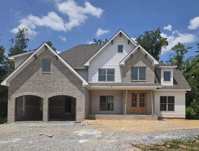 10586 Brownspring Dr Unit 113, Apison, TN 37302 - view of front of house featuring brick siding, roof with shingles, and gravel driveway