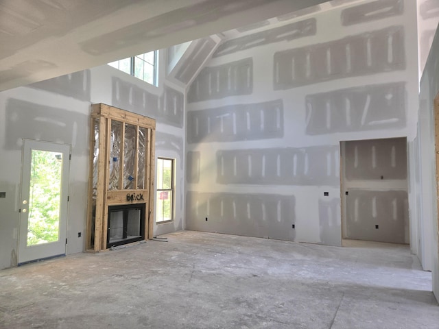 10586 Brownspring Dr Unit 113, Apison, TN 37302 - unfurnished living room featuring a high ceiling and a fireplace