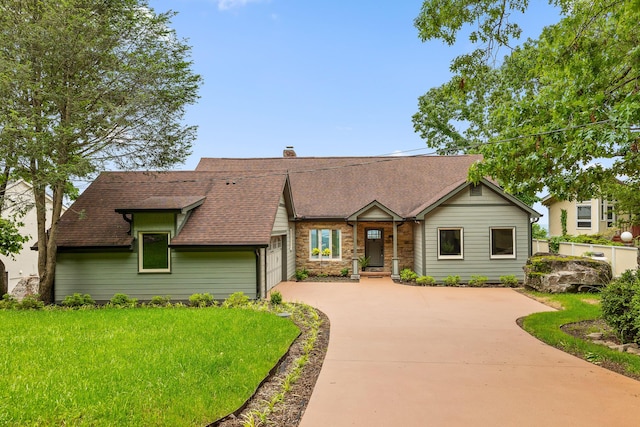 1206 Lower Brow Rd, Signal Mountain, TN 37377 - view of front facade with concrete driveway, an attached garage, a chimney, and a shingled roof