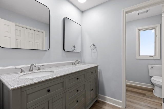1206 Lower Brow Rd, Signal Mountain, TN 37377 - full bathroom with toilet, wood finished floors, baseboards, and double vanity